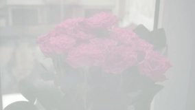 Pink roses flowers bunch stands on the windowsill against the backdrop of a fluttering white curtain - Powered by Shutterstock - Get 15% off with code: PIKWIZARD15