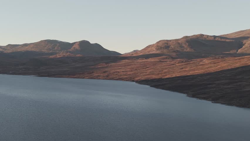 Evening sun lights up a mountains in Hemsedal, Norway. Drone footage