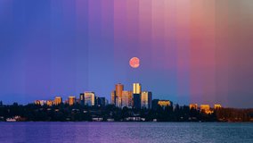 Creative timeslice video of Bellevue skyline showing full moon rising at sunset, capturing the transition from day to night. - Powered by Shutterstock - Get 15% off with code: PIKWIZARD15