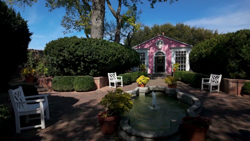 Discover the serene gardens at the Museum of the Shenandoah in Winchester, Virginia. Enjoy the peaceful landscape with vibrant plants and historic architecture.