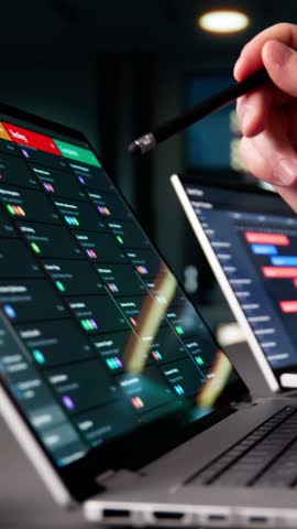 Agile Man Managing Multiple Boards On Laptop Computers