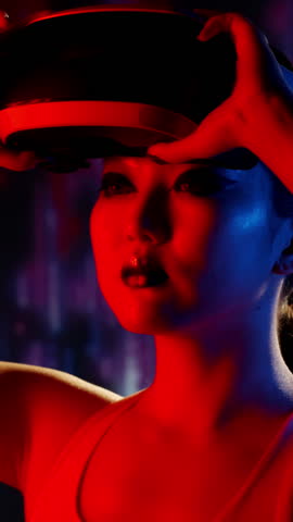 Profile View of Woman Wearing VR Headset Looking Around in Futuristic Neon Space