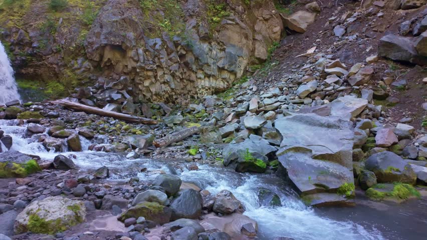 A captivating scenic view of Bloucher Falls, with its waters tumbling along Van Trump Creek amidst the stunning natural setting of Mount Rainier National Park
