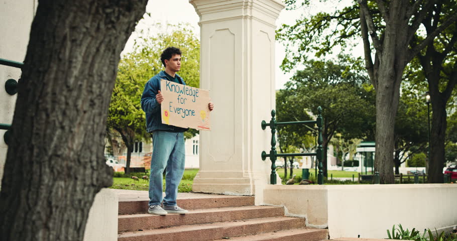 University, protest and student outdoor with poster for awareness, freedom and equality in education. Campus, college and man with sign, board and message for demonstration, justice and rights