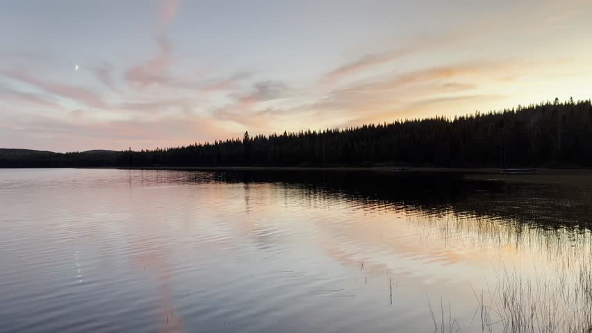 A lake at sunset in the forest. Quebec, Canada.