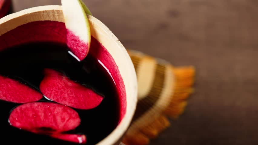 Sobolo, Hibiscus Drink, Vibrant red drink made from dried hibiscus petals, pineapple peels, ginger, cloves, and sweetened to taste