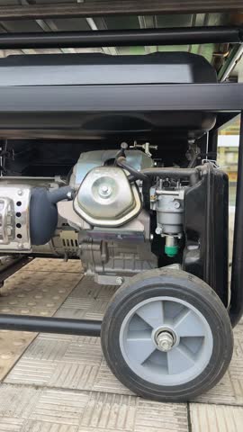 Working diesel generator producing electrical energy during a blackout, providing emergency power supply. Electricity generation using diesel and gasoline generators. Industrial production and backup