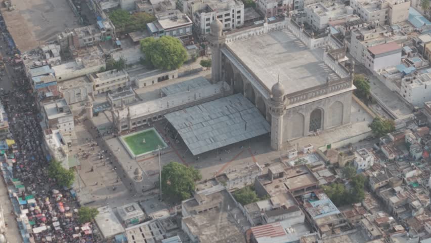 Aerial view of Charminar Mosque, Hyderabad — showcasing the historic monument, surrounding Old City, bustling streets, and rich Islamic architecture.