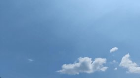 A panoramic view of a vast, clear blue sky with soft white cumulus clouds drifting gently. This serene, peaceful background is perfect for text or titles. - Powered by Shutterstock - Get 15% off with code: PIKWIZARD15