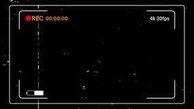 Retro 4K camcorder viewfinder overlay with recording indicator, timestamp, and battery. Features vintage film grain, dust, and scratches. Loopable motion graphic. - Powered by Shutterstock - Get 15% off with code: PIKWIZARD15