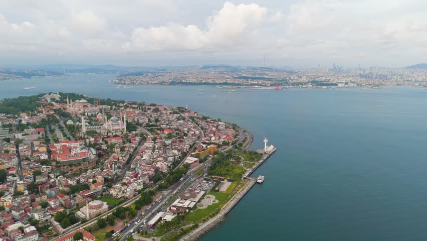 Istanbul, Turkey. Bosphorus embankment. Historical city center. Fatih district. Cloudy weather at sunset. Aerial View