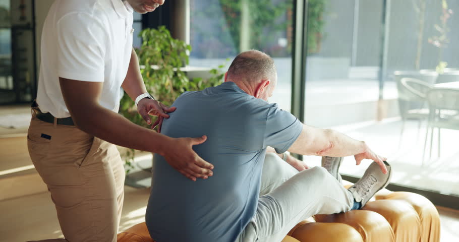 Personal trainer, senior man and stretching in house for health, workout support or flexibility challenge. Retirement fitness, people or coach help with exercise for mobility, resilience and wellness