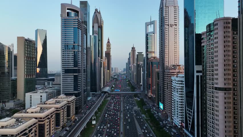 Aerial view Sheikh Zayed Road in Dubai with modern glass skyscrapers buildings, towers, busy traffic. urban skyline futuristic city architecture in United Arab Emirates business and financial district