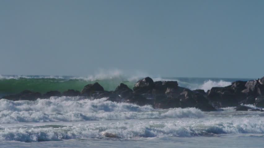 Large backwash wave hitting the break wall in SOCAL