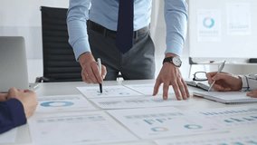 Business people team analyzing financial charts and graphs during strategy meeting in modern office, focusing on corporate planning, and decision making - Powered by Shutterstock - Get 15% off with code: PIKWIZARD15