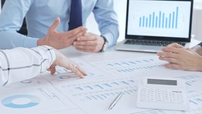 Business people having a financial meeting, discussing company strategy, reviewing data analysis, and planning future growth using charts and reports - Powered by Shutterstock - Get 15% off with code: PIKWIZARD15