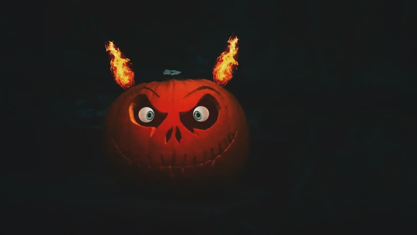 Halloween Pumpkin on the the Dark Background. Evil Pumpkin perfect for the halloween concept.Perfect spooky Halloween background with eerie light and festive horror vibes.