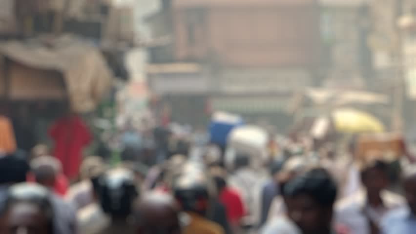 Bokeh view of crowded streeets near Mangaldas and Crawford market, Mumbai, India. Blurred background footage.