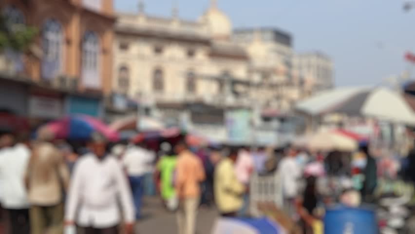Bokeh view of crowded streeets near Mangaldas and Crawford market, Mumbai, India. Blurred background footage.