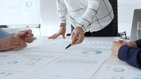 Business people team analyzing financial charts during strategy meeting, professionals discussing data and performance metrics at workplace for decision making success - Powered by Shutterstock - Get 15% off with code: PIKWIZARD15