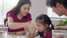 Family enjoying dinner together home dining room candid moment bright atmosphere close-up view connection and togetherness - Powered by Shutterstock - Get 15% off with code: PIKWIZARD15