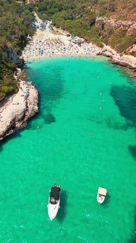 Aerial top down view of the Cala Llombards beach in Mallorca, Balearic Islands, Spain. Stunning Mediterranean Sea coast with turquoise water sea bay and white sand beach. Mallorca travel destinations