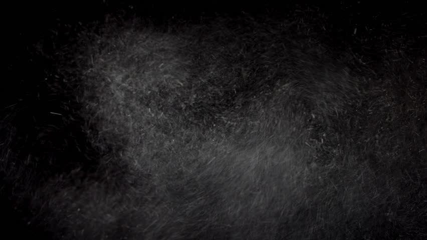 A sand or particle blizzard with black background