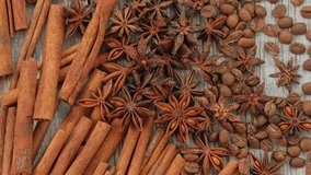 Rotating Cinnamon Sticks, Star Anise and Coffee Beans on Wooden Table - Powered by Shutterstock - Get 15% off with code: PIKWIZARD15