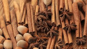 Slow Motion Rotation of Cinnamon Sticks, Star Anise and Coffee Beans on Wooden Surface with Warm Brown Aromatic Spices Background - Powered by Shutterstock - Get 15% off with code: PIKWIZARD15