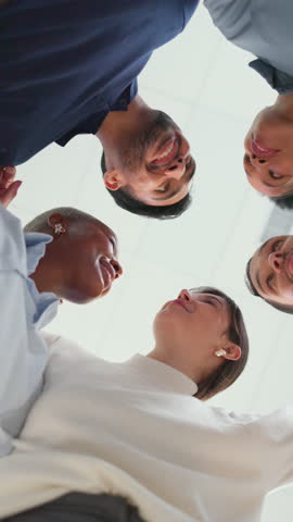 Business, people and discussion with hug in office for team building, work community and solidarity. Low angle, huddle and employees with talking in circle for feedback, cooperation and share ideas