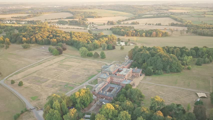 rom a wide drone glide, Wentworth Woodhouse stretches across South Yorkshire’s countryside with its historic wings, tree-lined paths, and open fields bathed in soft seasonal light.