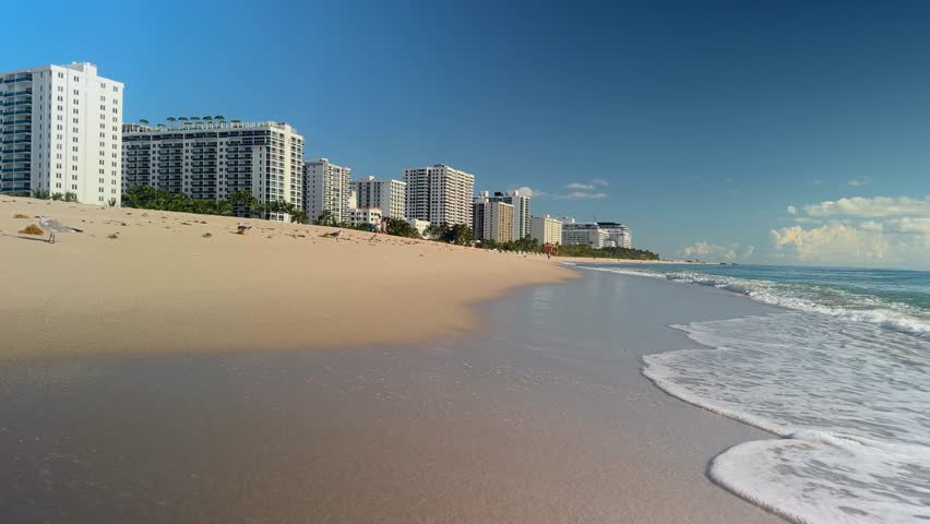 Sunny Morning View of Oceanfront Hotels and Waves on Miami Beach Shoreline