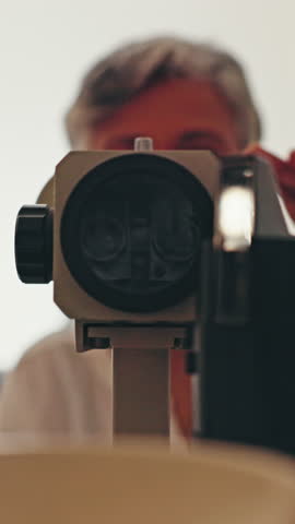 Optometrist, eye exam and woman in clinic, vision and equipment for health assessment and slit lamp. Ophthalmology, oculist and mature person with machine, test and medical appointment for eyesight