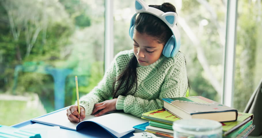Headphones, homework and girl with books for writing, studying and learning with music. Education, home and child with audio, lesson podcast and listening to sound to concentrate on academic activity