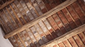 Antique ceiling made of wooden planks and red bricks, renovated and improved rooftop of antique house, architectural features of historical building. High quality 4k footage - Powered by Shutterstock - Get 15% off with code: PIKWIZARD15