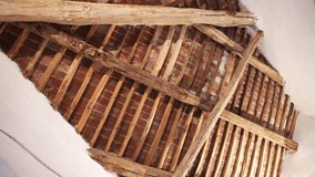Antique ceiling made of wooden planks and red bricks, white stone arch holding rooftop inside the house, medieval buildings interior construction concept. High quality 4k footage - Powered by Shutterstock - Get 15% off with code: PIKWIZARD15