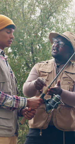 Fishing, talking and travel with friends outdoor for adventure, casting advice or bonding. Fisherman season, reel gear discussion and camping vacation with group of people in nature for rod equipment