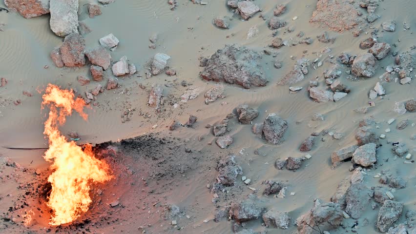 Day time view of fire in the Darvaza Gas Crater in Turkmenistan