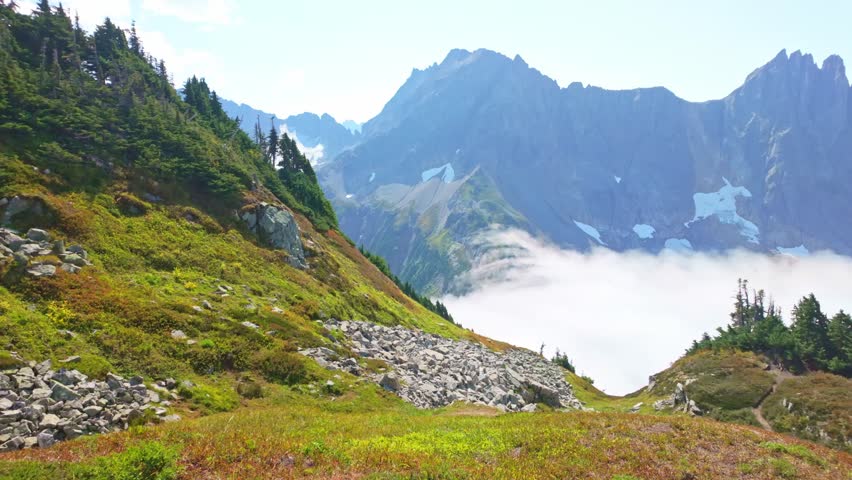 Scenic view of clouds flying through the majestic Sahale Arm, along the Cascade Pass Trail in North Cascades National Park