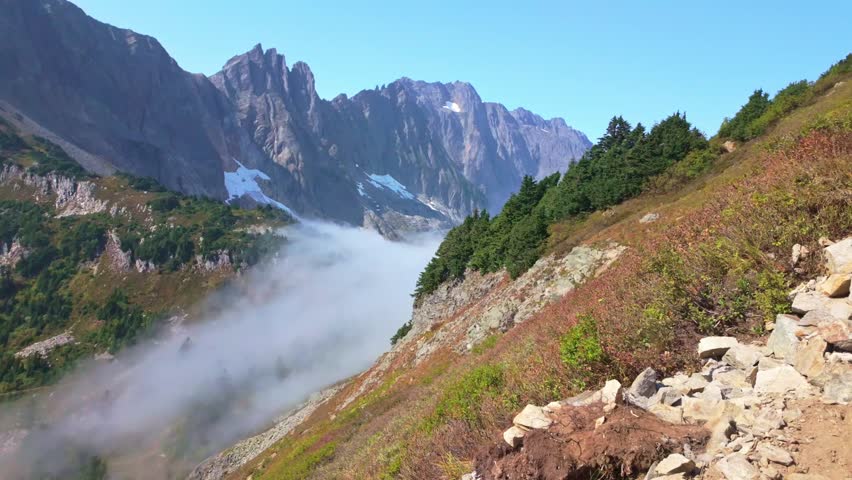 Scenic view of clouds flying through the majestic Sahale Arm, along the Cascade Pass Trail in North Cascades National Park