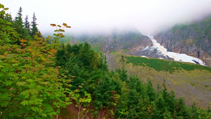 A scenic and expansive view of the majestic North Cascades mountain range, captured from the Sahale Arm along the Cascade Pass Trail