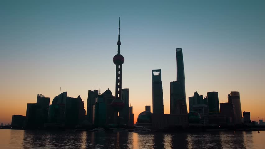 Shanghai China City Skyline at Sunrise with Iconic Tower and River View