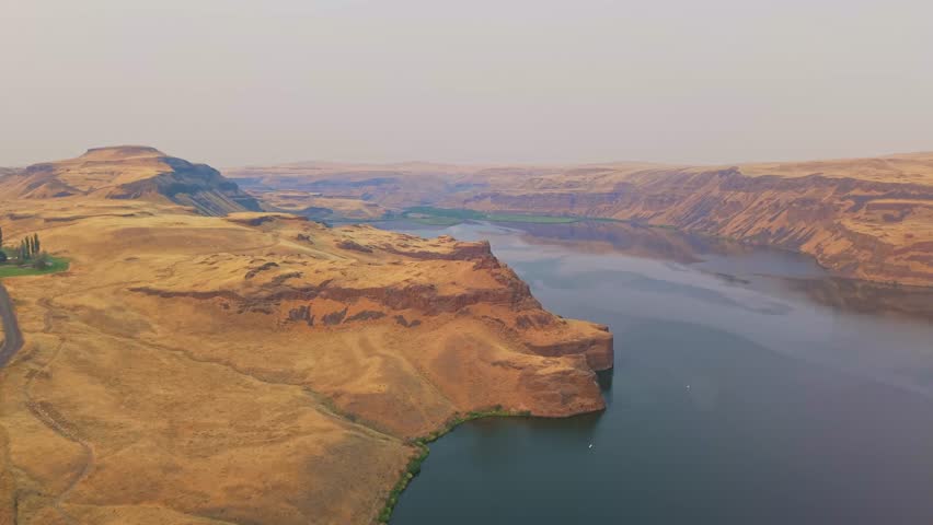 A breathtaking aerial view of the meandering Palouse River and distant mountain ranges near Lyons Ferry State Park