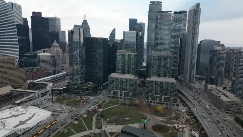 Aerial view of tall office towers reflecting sunlight in Toronto’s business center, symbol of Canadian finance and architecture