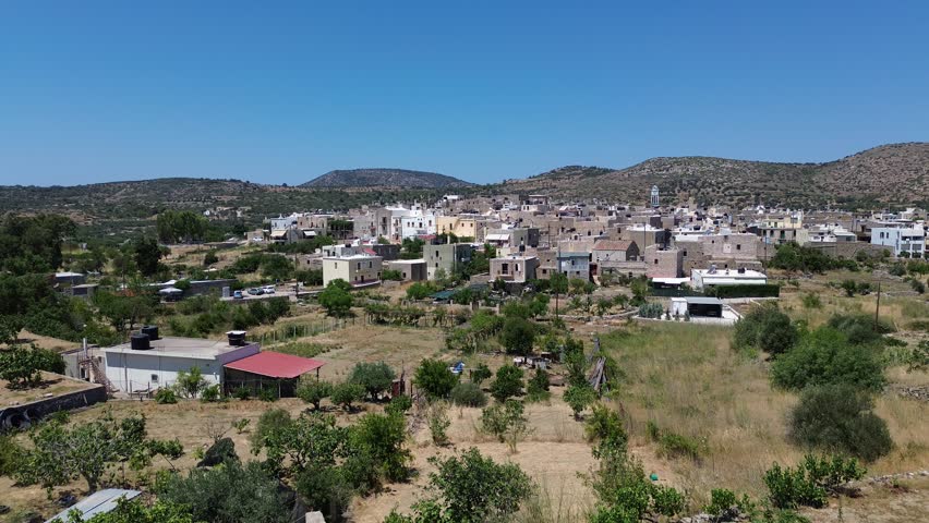 Olympoi, Chios island, Greece - July 20th, 2025 - footage of the village, exterior of the houses, mountains around, traditional medieval streets and mastic region landscapes