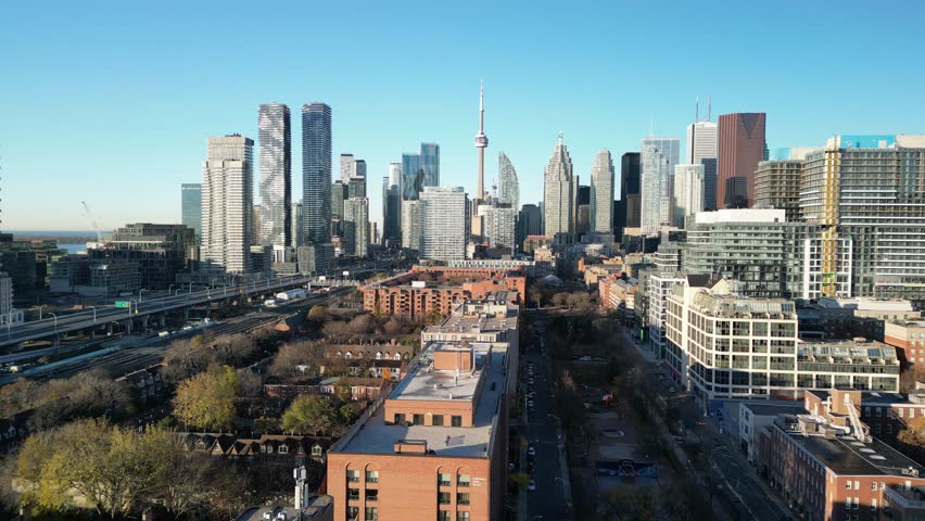 Smooth drone flight showcasing Toronto’s financial district and CN Tower surrounded by high-rise towers and bright colours. Great for business, travel, and cinematic intros