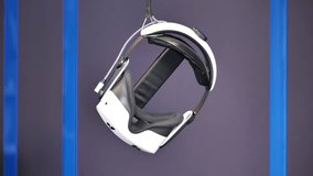 Virtual reality headset hanging in a modern tech display - Powered by Shutterstock - Get 15% off with code: PIKWIZARD15