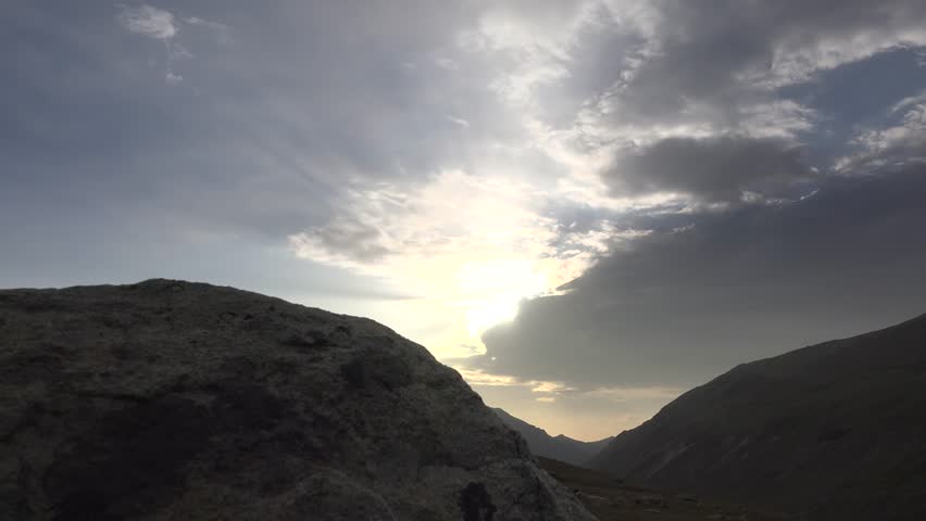 Time-lapse view of the treeless natural landscape in Golestan National Park, Iran. Rolling hills, plains, and dry valleys reveal the beauty of semi-arid Iranian geography under clear skies.