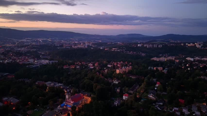 This breathtaking aerial landscape view beautifully captures the essence of the city and nature at dusk