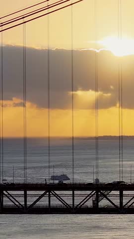 Sunset Sky Over 25 Of April Bridge At Lisbon In Lisbon District Portugal. Sunset Downtown. Freeway Road Landscape. 25 Of April Bridge At Lisbon In Portugal. Railroad Scenery.